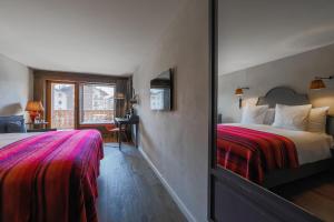 Letto o letti in una camera di La Cordée des Alpes SUP