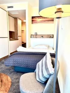 Кровать или кровати в номере LikeDaheim Apartments