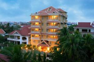 a large building with lights on in a city at Grand Residence in Phnom Penh