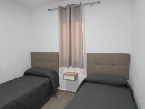 Posteľ alebo postele v izbe v ubytovaní MOJACAR SUN 365