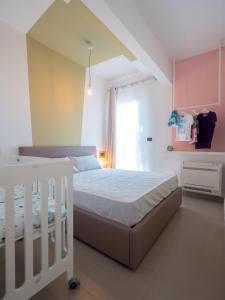 Ένα ή περισσότερα κρεβάτια σε δωμάτιο στο Babyaccommodation Family Comfort III +13 φωτογραφίες