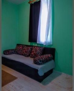 Een bed of bedden in een kamer bij Vila Vedrana Apartman Nedeljkovic