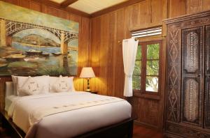 Ένα ή περισσότερα κρεβάτια σε δωμάτιο στο Alindra Villas & Spa
