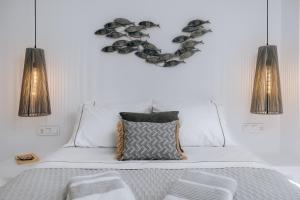 a bedroom with a bed with a heart shaped wall at Xerolithos Natural Living in Naxos Chora