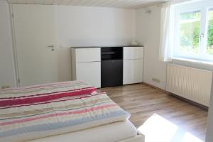 Postel nebo postele na pokoji v ubytování EG nahe am Bodensee