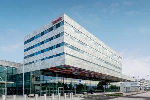 a tall building with a lot of windows at Scandic Landvetter in Landvetter