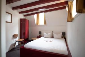 Postel nebo postele na pokoji v ubytování Hotel Internationaal