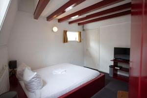 Postel nebo postele na pokoji v ubytování Hotel Internationaal