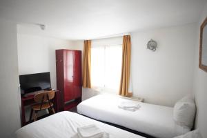 Postel nebo postele na pokoji v ubytování Hotel Internationaal