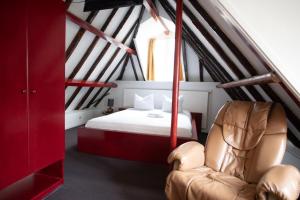 Postel nebo postele na pokoji v ubytování Hotel Internationaal