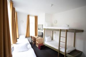 Postel nebo postele na pokoji v ubytování Hotel Internationaal