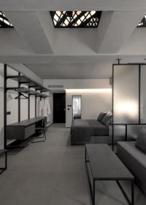 Letto o letti in una camera di Essence Suites Downtown Suites - Adults Only