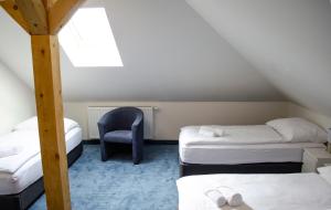 Posteľ alebo postele v izbe v ubytovaní Penzión Pohoda