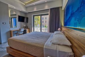a hotel room with a large bed and a window at Island Boutique Hotel in Rhodes Town