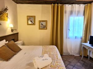 Postel nebo postele na pokoji v ubytování Hotel Rural & Spa Mas Prat