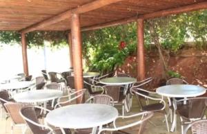 a group of tables and chairs on a patio at Aguas da Serra in Rio Quente