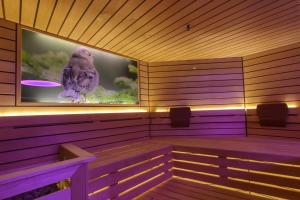 Televízia a/alebo spoločenská miestnosť v ubytovaní Residence Hotel Santa Maria piscina e wellness