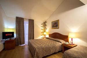 Postel nebo postele na pokoji v ubytování Intra Hotel