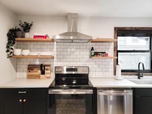 a kitchen with a stove and a sink at Black Pearl Unit 1 - Lake Placid, Mirror Lake in Lake Placid