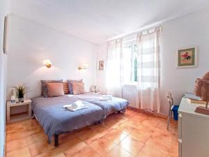 Letto o letti in una camera di Chambres d'hôtes Avignon