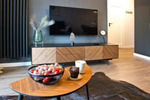 Televízia a/alebo spoločenská miestnosť v ubytovaní Marina Mokotow P&O Serviced Apartments