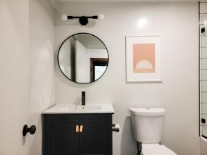 a bathroom with a sink and a mirror on the wall at Black Pearl Unit 2 - Lake Placid, Mirror Lake in Lake Placid