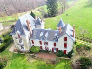 an aerial view of a large house in a field at Château de la Combe in La Celle