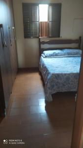 Ένα ή περισσότερα κρεβάτια σε δωμάτιο στο Casa de Temporada Serra da Canastra - São Roque de Minas