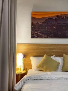 מיטה או מיטות בחדר ב-Sirichai Design Hotel