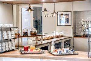 a kitchen with two plates of food on a counter at Hotel Isola Sacra Rome Airport in Fiumicino