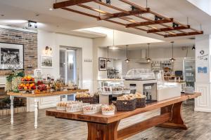 a kitchen with a counter with baskets of fruit at Hotel Isola Sacra Rome Airport in Fiumicino