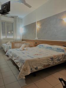 Posteľ alebo postele v izbe v ubytovaní Hotel Marinoni