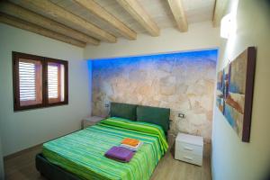 Ένα ή περισσότερα κρεβάτια σε δωμάτιο στο Case Vacanze Budoni Beach +64 φωτογραφίες