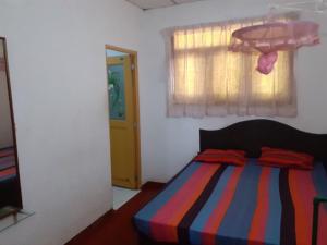 Un pat sau paturi într-o cameră la Fort Sea View Hotel