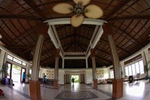 a large lobby with a ceiling fan in a building at Henann Regency Resort and Spa in Boracay