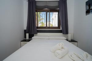 A bed or beds in a room at Rosa Chenz