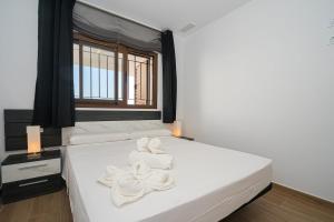 A bed or beds in a room at Rosa Chenz
