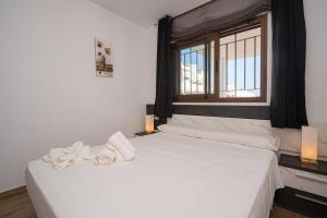 A bed or beds in a room at Rosa Chenz