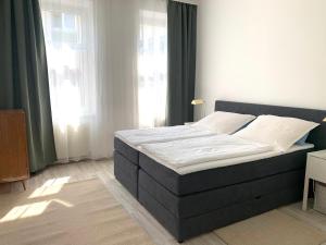 Кровать или кровати в номере Tada Apartment