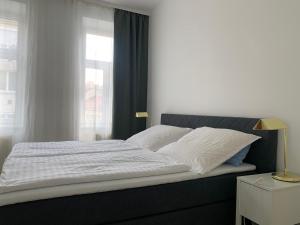 Кровать или кровати в номере Tada Apartment