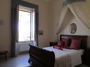 Ένα ή περισσότερα κρεβάτια σε δωμάτιο στο Villa Li Putti Luxury B&B