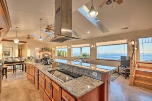 a large kitchen with a sink and a counter top at Crescent City Getaway with Panoramic Ocean Views! in Crescent City