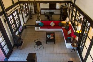 an overhead view of a living room with a red couch at Pousada do Adriano in Búzios