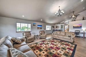 a large living room with couches and chairs at The Vineyard Country Farm Home at Grand Valley in Grand Junction