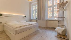 Säng eller sängar i ett rum på CityApartment - 53 m², 2 Zimmer, zentral, Netflix, Küche, Waschmaschine