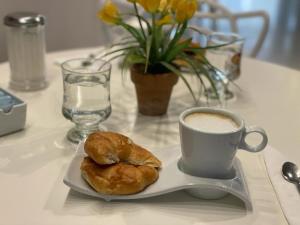 a plate of food on a table with a cup of coffee at Cristal Palace Hotel in Buenos Aires
