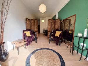 A seating area at Green tea balcony - quiet & cozy- Ano Glyfada