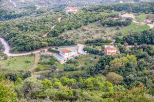 an aerial view of a house on a hill at VILLA MITZELOS in Skiathos