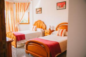 A bed or beds in a room at Villa Cervantes Sonnenland con piscina privada climatizada