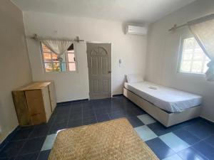 מיטה או מיטות בחדר ב-Barco Verde Hostel